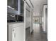 Hallway laundry area equipped with modern washer and dryer, and plenty of storage at 2275 62Nd N Ave # 5202, St Petersburg, FL 33702