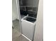 Laundry closet with new washing machine featuring shelves and mirrored sliding door at 2275 62Nd N Ave # 5202, St Petersburg, FL 33702