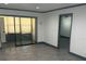 Well lit living room featuring a large sliding glass door, and updated flooring at 2275 62Nd N Ave # 5202, St Petersburg, FL 33702