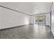 Spacious living room featuring neutral paint, tile flooring, and sliding glass doors to the patio at 2275 62Nd N Ave # 5202, St Petersburg, FL 33702