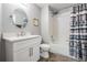 Well-lit bathroom featuring a vanity, framed mirror, toilet, and shower-tub combination at 25324 Lexington Oaks Blvd, Wesley Chapel, FL 33544