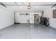 Spacious two car garage with epoxy floors, storage and garage door opener at 25324 Lexington Oaks Blvd, Wesley Chapel, FL 33544