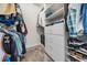 Organized walk-in closet with shelving, drawers, hanging space, and carpeted floor at 25324 Lexington Oaks Blvd, Wesley Chapel, FL 33544