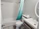 Cozy bathroom featuring a tub with shower, simple vanity, and decorative mirror at 2830 W Bay Haven Dr, Tampa, FL 33611