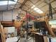 Spacious workshop featuring high ceilings, a loft area, and abundant workspace with equipment at 2830 W Bay Haven Dr, Tampa, FL 33611