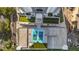 Overhead view of a building with rooftop basketball court, putting green, and parking at 2910 W Barcelona St # 1902, Tampa, FL 33629