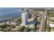Stunning aerial view of the modern high-rise condominium complex with waterfront views and a pool at 2910 W Barcelona St # 1902, Tampa, FL 33629
