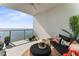 Furnished balcony featuring outdoor seating, a coffee table, and water views at 2910 W Barcelona St # 1902, Tampa, FL 33629