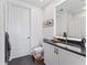 Contemporary bathroom featuring sleek vanity with dark countertops and tiled floors at 2910 W Barcelona St # 1902, Tampa, FL 33629
