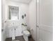 Stylish half bathroom features a modern sink, a tiled floor, and decor accents at 2910 W Barcelona St # 1902, Tampa, FL 33629