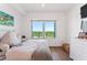 Bright bedroom offering city views from the windows and contemporary decor at 2910 W Barcelona St # 1902, Tampa, FL 33629
