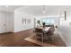 Dining area with a large table, comfortable seating, and modern lighting at 2910 W Barcelona St # 1902, Tampa, FL 33629