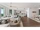 Spacious open-concept living room featuring water views and adjacent kitchen and dining areas at 2910 W Barcelona St # 1902, Tampa, FL 33629