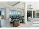 Spacious, modern living room with designer furniture, marble floors, and floor-to-ceiling windows at 2910 W Barcelona St # 1902, Tampa, FL 33629