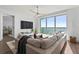 Open living room with large windows and views of the water at 2910 W Barcelona St # 1902, Tampa, FL 33629
