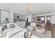 Bright, open-plan living area with modern furniture, stylish decor, and a ceiling fan at 2910 W Barcelona St # 1902, Tampa, FL 33629