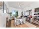 Charming home office with a fan, a window, decorated walls, and wood floors at 2910 W Barcelona St # 1902, Tampa, FL 33629