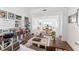 Stylish office space with wood floors, desk with laptop, and a view into the dining room at 2910 W Barcelona St # 1902, Tampa, FL 33629