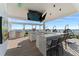 Outdoor kitchen with bar seating, grill, and ocean views at 2910 W Barcelona St # 1902, Tampa, FL 33629