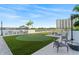 Scenic putting green with outdoor kitchen, seating area, and a picturesque view at 2910 W Barcelona St # 1902, Tampa, FL 33629