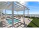 Inviting rooftop deck with a pergola-covered hot tub and ample seating areas at 2910 W Barcelona St # 1902, Tampa, FL 33629