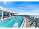 Stunning rooftop pool with lounge chairs and a panoramic view of the city skyline and waterfront at 2910 W Barcelona St # 1902, Tampa, FL 33629
