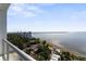 Scenic water view from a high-rise balcony, featuring city views and lush greenery at 2910 W Barcelona St # 1902, Tampa, FL 33629