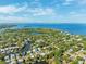 Stunning aerial view of the community, waterfront, and surrounding landscape at 294 Kentucky Ave, Crystal Beach, FL 34681
