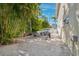 Backyard area showing boat trailer storage space with lush tropical surroundings at 294 Kentucky Ave, Crystal Beach, FL 34681