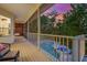 Beautifully screened-in deck overlooking a tropical pool and hot tub, providing a relaxing outdoor living space at 294 Kentucky Ave, Crystal Beach, FL 34681