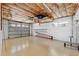 Attached garage with epoxy floor, storage, and garage door at 294 Kentucky Ave, Crystal Beach, FL 34681