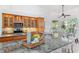 Gourmet kitchen with granite counters and backsplash, stainless steel appliances and ample cabinet space at 294 Kentucky Ave, Crystal Beach, FL 34681