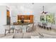 Open kitchen with ample seating at the bar top, bright lighting, and stainless steel appliances at 294 Kentucky Ave, Crystal Beach, FL 34681