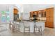 Bright kitchen featuring granite counters, stainless appliances, and glass front cabinets with under cabinet lighting at 294 Kentucky Ave, Crystal Beach, FL 34681