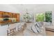 Bright, open kitchen flows into the living area, with ample bar seating and high-end appliances at 294 Kentucky Ave, Crystal Beach, FL 34681