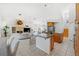 Open concept living space featuring modern island seating, cozy fireplace, and stainless appliances at 294 Kentucky Ave, Crystal Beach, FL 34681