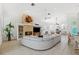 Open-concept living area featuring a cozy fireplace, neutral decor, and seamless flow to the dining area at 294 Kentucky Ave, Crystal Beach, FL 34681