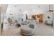 Open concept living area with tile flooring, ample seating, and seamless flow into the kitchen at 294 Kentucky Ave, Crystal Beach, FL 34681