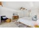 Bright main bedroom with a fan, a large area rug, and furnishings with nature accents at 294 Kentucky Ave, Crystal Beach, FL 34681