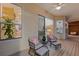 Relaxing outdoor patio with comfortable seating overlooking the landscaped yard and bright interior views at 294 Kentucky Ave, Crystal Beach, FL 34681