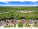 Tranquil waterfront homes surrounded by lush greenery and mature trees offer privacy and scenic views at 29737 Fog Hollow Dr, Wesley Chapel, FL 33543