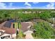 Well-maintained home with a screened-in pool, solar panels, and mature trees in a quiet neighborhood at 29737 Fog Hollow Dr, Wesley Chapel, FL 33543