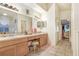 Bathroom with double sinks, lots of vanity space and a view into the main bedroom at 29737 Fog Hollow Dr, Wesley Chapel, FL 33543