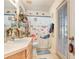 Themed ' bathroom with shower/tub combination and door to exterior at 29737 Fog Hollow Dr, Wesley Chapel, FL 33543