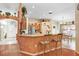 Open kitchen features a breakfast bar and modern appliances at 29737 Fog Hollow Dr, Wesley Chapel, FL 33543