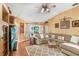Living room with neutral tones, modern ceiling fan, and area rug at 29737 Fog Hollow Dr, Wesley Chapel, FL 33543