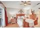 Comfortable main bedroom suite with a wooden bed frame, wood flooring, and an abundance of natural light at 29737 Fog Hollow Dr, Wesley Chapel, FL 33543