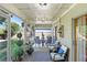 Relaxing screened-in patio with comfortable seating and outdoor decor at 29737 Fog Hollow Dr, Wesley Chapel, FL 33543