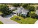 Bird's-eye view showcasing the home's architectural details, manicured landscaping, and proximity to green spaces at 30247 Fairway Dr, Wesley Chapel, FL 33543