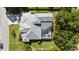 Overhead shot of the property showcasing the roof and screened-in pool area, highlighting the home's layout and backyard at 30247 Fairway Dr, Wesley Chapel, FL 33543